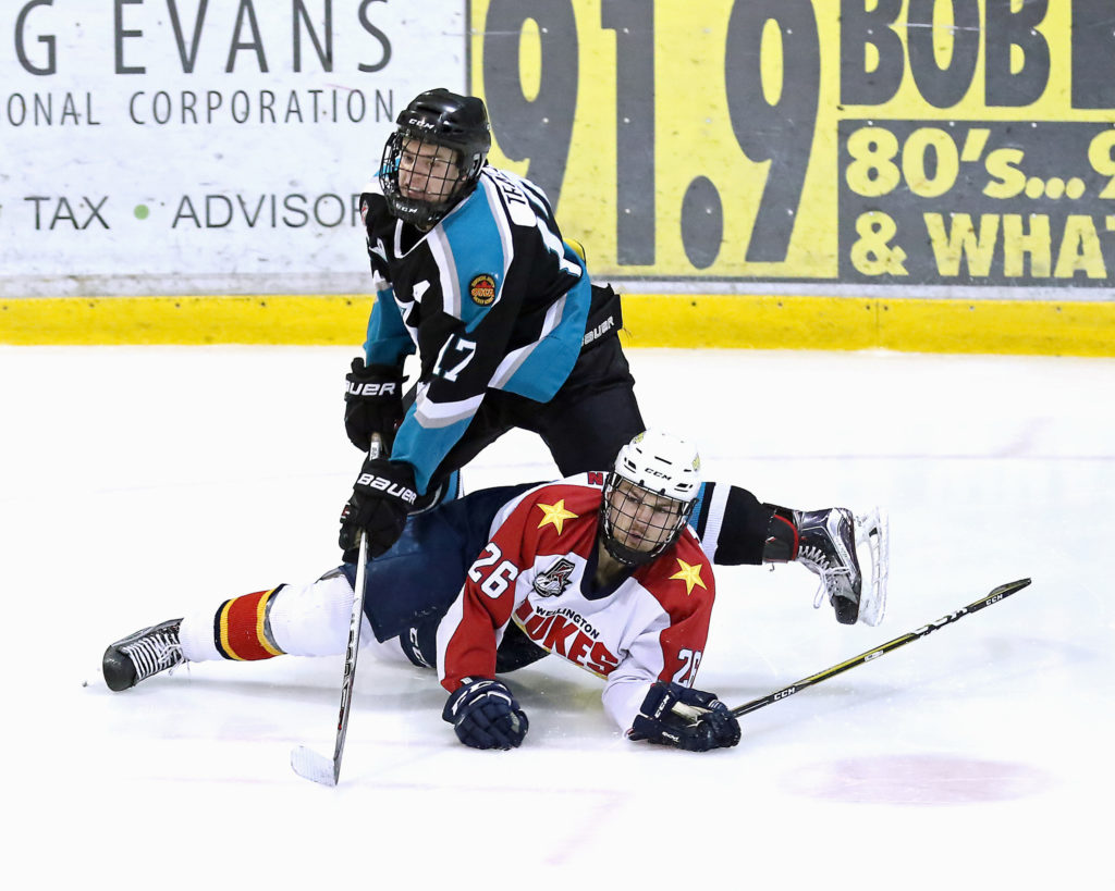 <p>Brock Traill of the Lindsay Muskies tangles with Keegan Ferguson of the Wellington Dukes during Wellington’s 6-3 win Friday night in Lindsay.(Photo by Ed McPherson / OJHL Images)</p>
