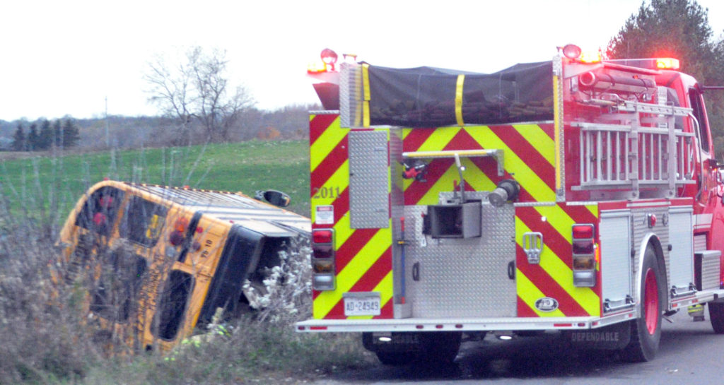 <p>Scary scene – An overturned school bus sits at the side of Shannon Road west of County Rd. 32 Monday. (Adam Bramburger/Gazette staff)</p>

