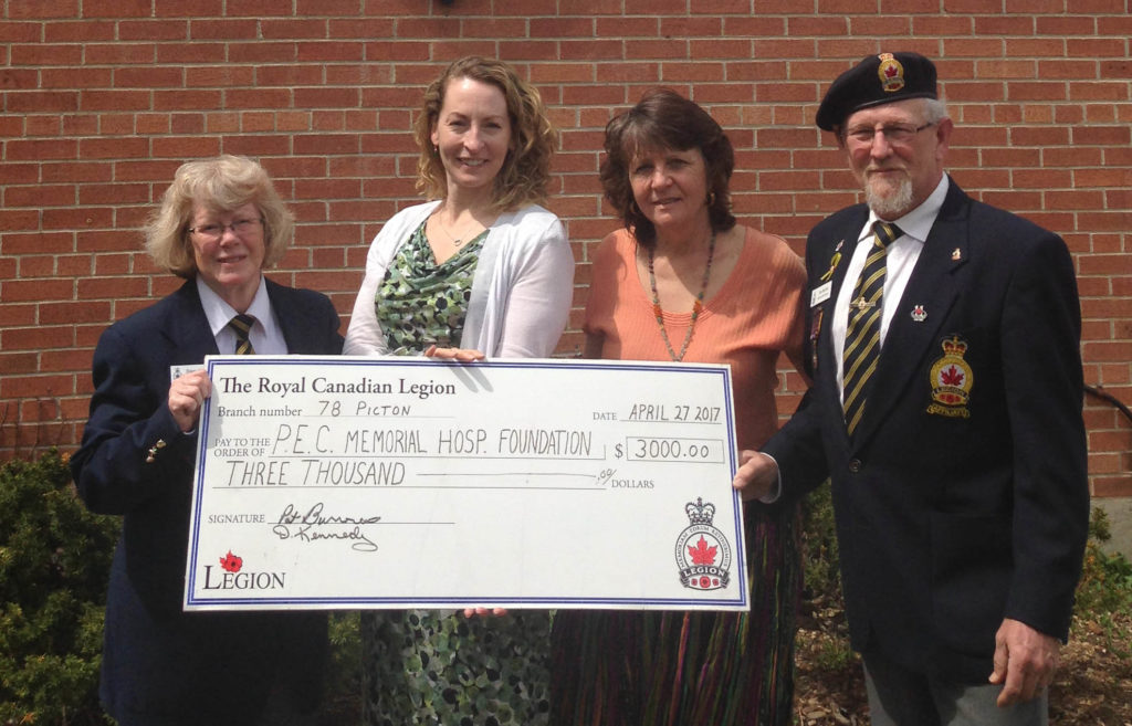 <p>Poppy power – Royal Canadian Legion Branch 78 president Diane Kennedy, left, and vice-president and Poppy chair Tom McCaw presented a $3,000 Poppy Fund donation to Prince Edward County Memorial Hospital Foundation executive director Penny Rolinski and chair Monica Alyea last April. With the money, a defibrillator was purchased. (Briar Boyce/For The Gazette)</p>
