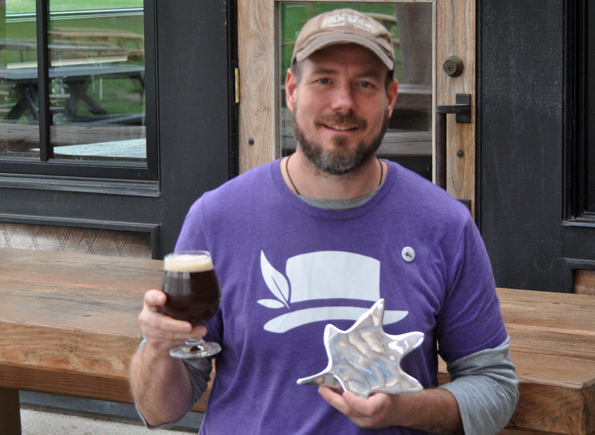 <p>Cheers! – Chris Parsons holds up a pint of his brew to celebrate the          Sustainability Award Parsons Brewing Company won at Friday’s Quinte Business Achievement Awards gala.(Adam Bramburger/Gazette staff)</p>
