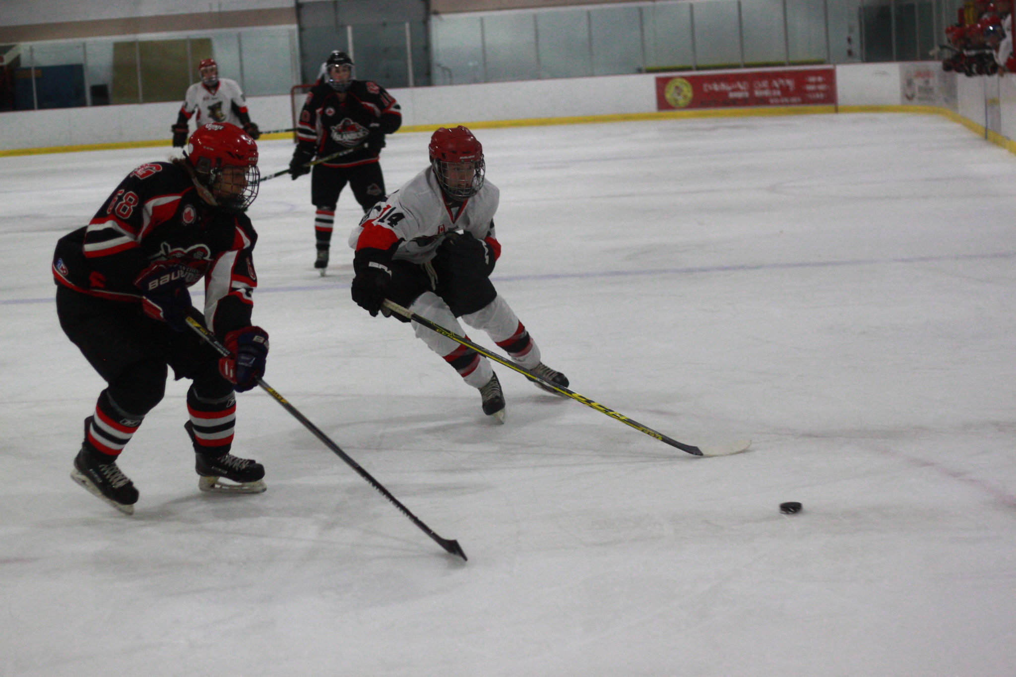 <p>Gananoque’s Lucas Sanders and Picton’s Brayden Bertrand race to a loose puck during the opening period of last Thursday’s 6–1 win.</p>
