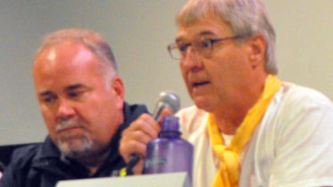 <p>Cracks and crevices – Ecologist Les Stanfield talks about the risks of construction on fractured limestone as Prince Edward-Hastings MPP Todd Smith looks on Sunday. (Adam Bramburger/Gazette staff)</p>
