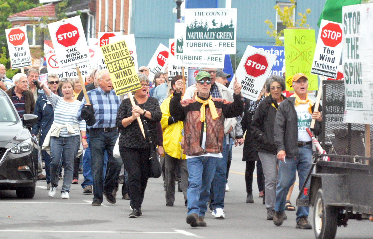 <p>New venue – Opponents of the White Pines Wind Project took to the streets of Picton last month to voice their concerns. Tomorrow, one of the groups opposing the project, the Alliance to Protect Prince Edward County was to argue for an injunction to stop work at the project but the hearing was postponed. (Adam Bramburger/Gazette file photo)</p>

