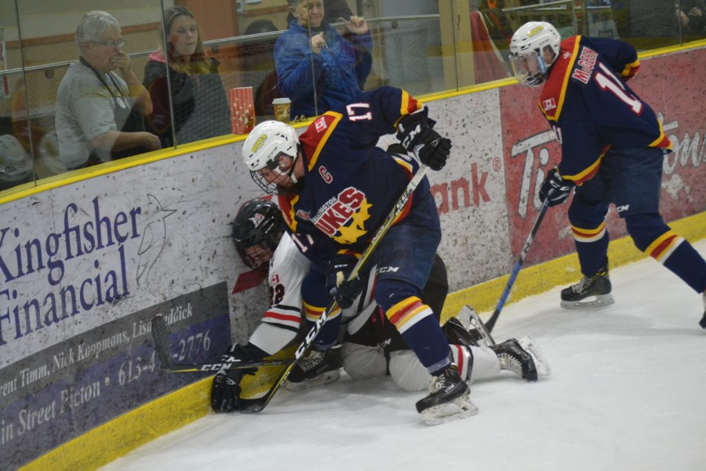 <p>Wellington Dukes Captain Colin Doyle digs for the puck during Friday night’s 1-0 win over the visiting Mississauga Chargers. (Jason Parks/Gazette staff)</p>
