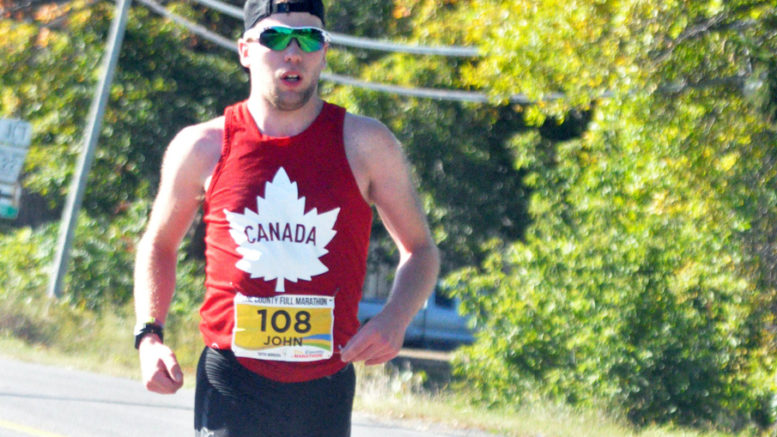 <p>John Bauer, of Hamilton, runs up Lake Street toward the finish of the 14th annual County Marathon. The 23-year-old finished 10 minutes ahead of the second-place runner. (Adam Bramburger/Gazette staff)</p>
