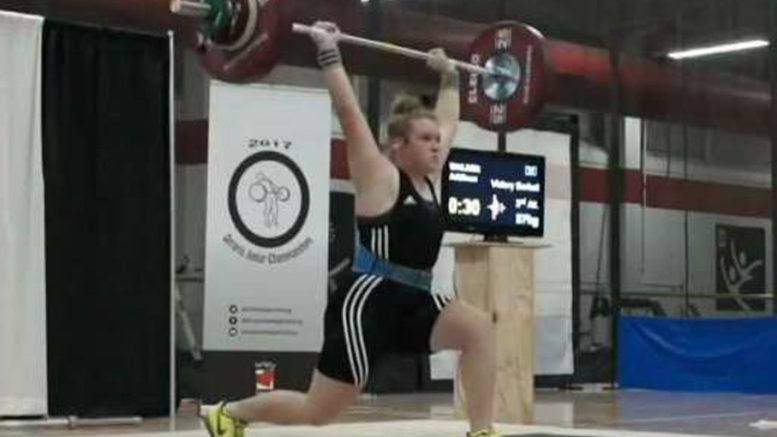 <p>Golden lift – Addison Walker, 16, of the Victory Barbell Club holds aloft an 87-kg attempt in the clean-and-jerk event. She placed first in her category at the Ontario Junior Weightlifting Championships. (Submitted photo)</p>
