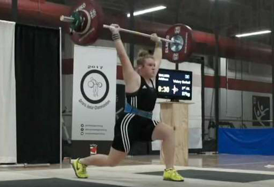 <p>Golden lift – Addison Walker, 16, of the Victory Barbell Club holds aloft an 87-kg attempt in the clean-and-jerk event. She placed first in her category at the Ontario Junior Weightlifting Championships. (Submitted photo)</p>
