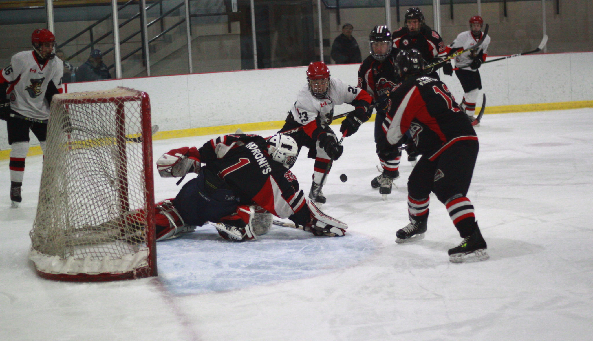 <p>Pirates forward Gerald Bilker drives to the net with Islanders goaltender Josh Rowden stretching to make the save. (Chad Ibbotson/Gazette staff)</p>
