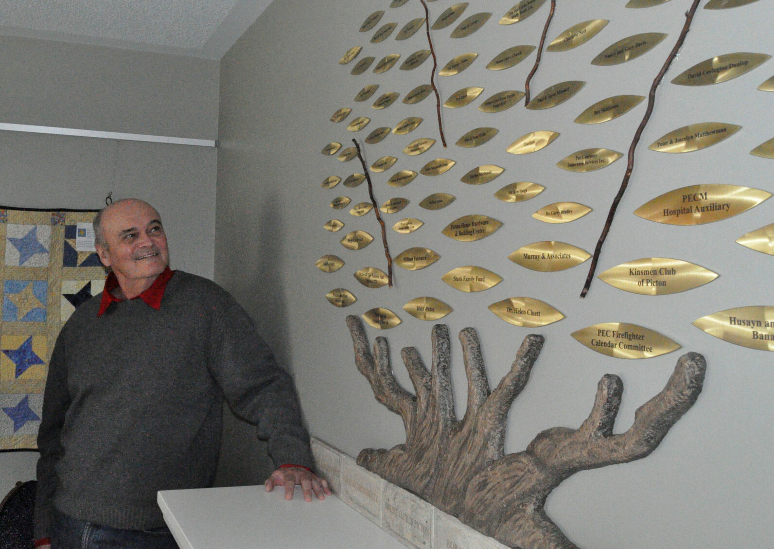 <p>Taking root – Outgoing board chair Peter Matthewman admires a new donor tree installedin 2017. The tree recognizes significant financial contributions to the organization. (Adam Bramburger/Gazette File Photo)</p>
