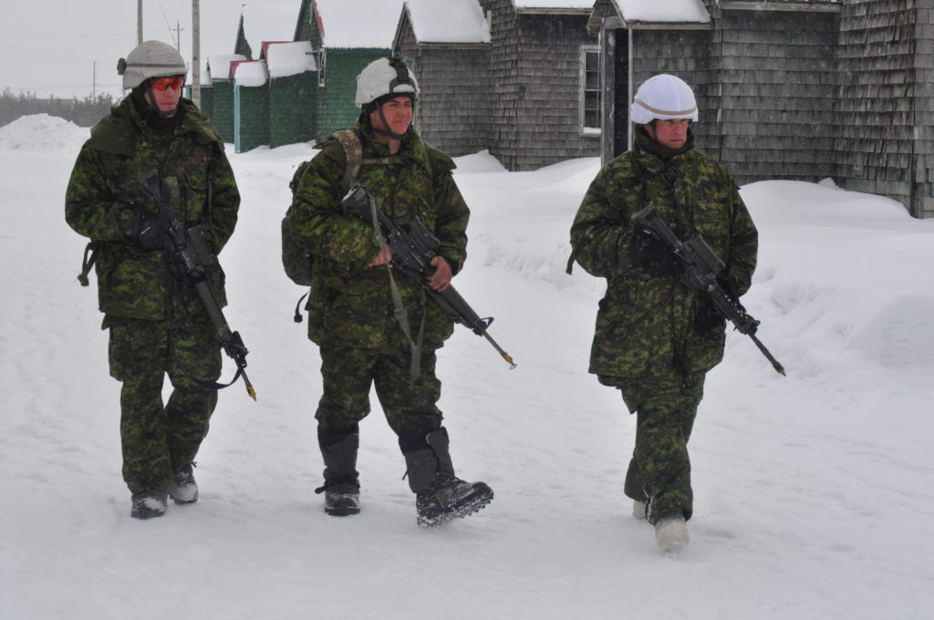 <p>TOUGH TRAINING- Members of the Canadian Armed Forces patrol an area at Loch Sloy Business Park during a training exercise in 2014.  (Adam Bramburger/Gazette Staff)</p>
