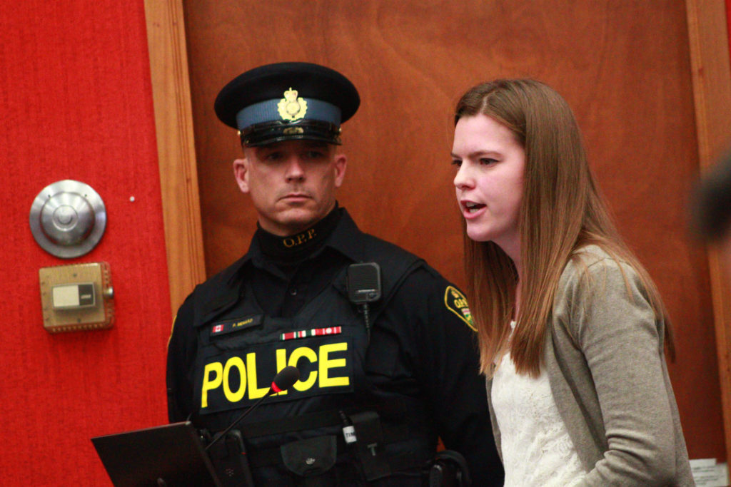 <p>Prince Edward OPP community safety officer Const. Patrick Menard and Farm 911 committee member Resi Walt discuss the project with councillors last week. (Chad Ibbotson/Gazette staff)</p>
