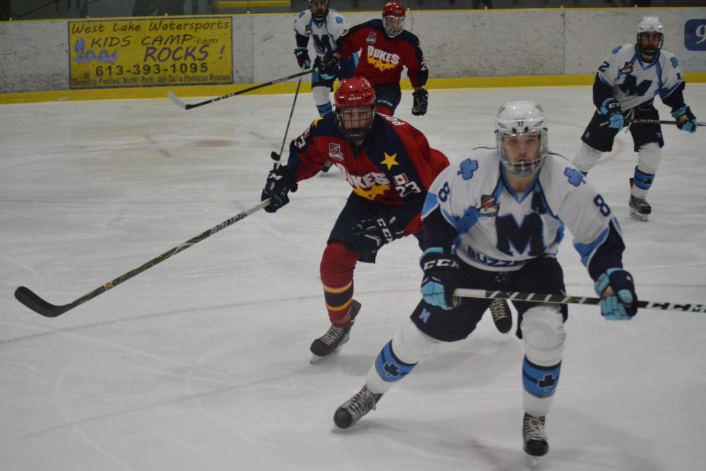 <p>POWER PLAY- Wellington Dukes forward Nelson Powers has St. Michael’s Buzzer defenceman Mike Pellegrini in his sights during Wellington’s 3-2 overtime win Sunday afternoon at Essroc Arena. (Jason Parks/Gazette Staff)</p>
