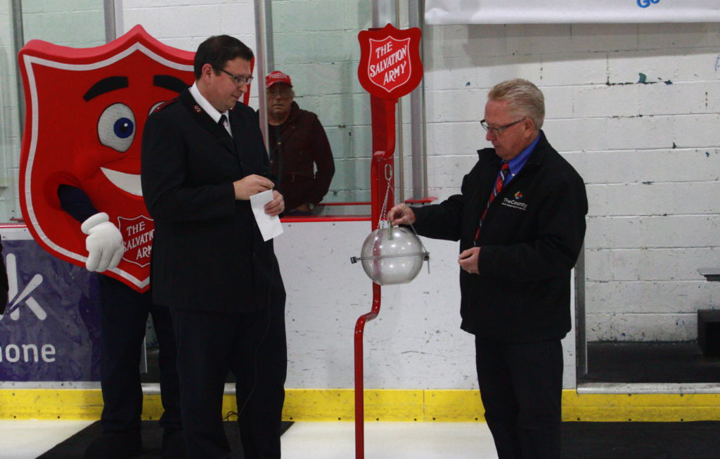 <p>Salvation Army Lieutenant Joe Ludlow welcomes Mayor Robert Quaiff to make the first donation to this year’s Christmas Kettle Campaign. (Chad Ibbotson/Gazette staff)</p>
