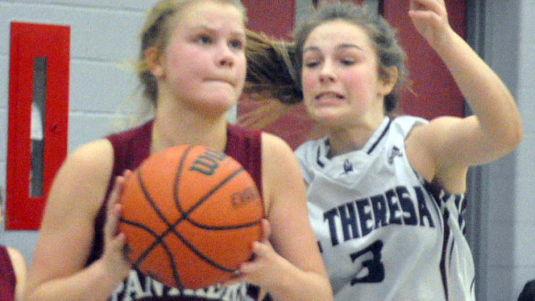 <p>Dogged defence – PECI Panther ball handler Madalynn Snider tries to keep her concentration on making a play as St. Theresa Titan defender Kaila Hinch closes in on the ball during Friday’s championship game. The Panthers kept pace with the Titans into the third quarter in St. Theresa’s 10-point victory. (Adam Bramburger/Gazette staff)</p>
