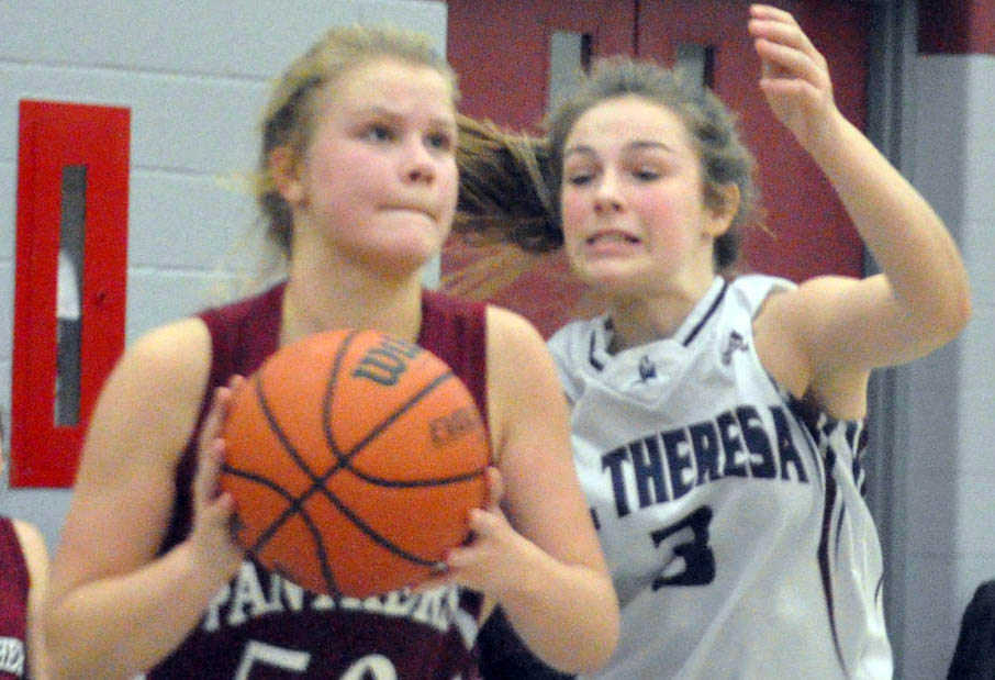 <p>Dogged defence – PECI Panther ball handler Madalynn Snider tries to keep her concentration on making a play as St. Theresa Titan defender Kaila Hinch closes in on the ball during Friday’s championship game. The Panthers kept pace with the Titans into the third quarter in St. Theresa’s 10-point victory. (Adam Bramburger/Gazette staff)</p>
