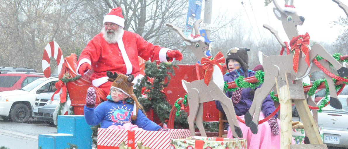 <p>A thing of the past?  This image of Santa Claus greeting parade goers in Consecon last year might be one of the last as the community has cancelled its parade this year. Organizers are hoping some new people step forward to ease the load on volunteers. (Adam Bramburger/Gazette staff)</p>

