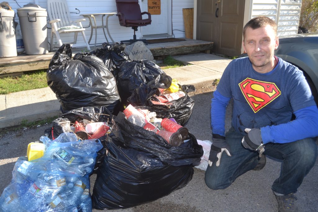 <p>Donnie Duffy shows the four bags of garbage and a bag of recyclables he collected during a walk to Picton’s Main Street from his home at Macaulay Village on Monday. (Jason Parks/PIcton Gazette)</p>
