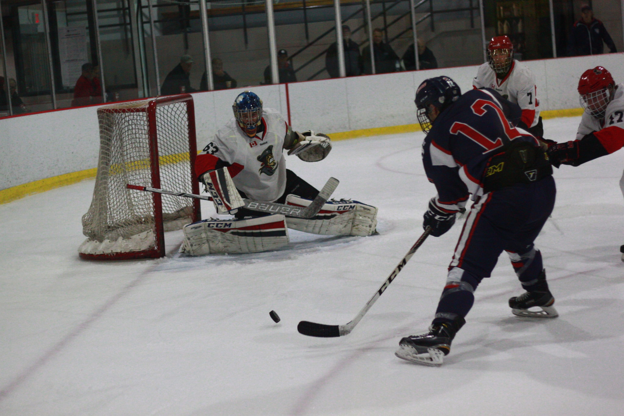 <p>Picton Pirates goaltender Aaron Young stares down Port Hope Panther Brad Bollert during the second period of last Thursday’s 6–2 loss. (Chad Ibbotson/Gazette staff)</p>
