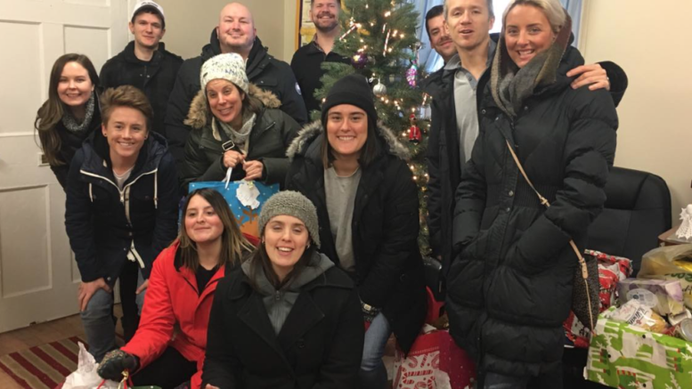 <p>KICKING IT- Staff Members of KA Media of Bloomfield deliver gifts for the Angels they selected form the Angel Tree earlier this holiday season. (Submitted Photo)</p>
