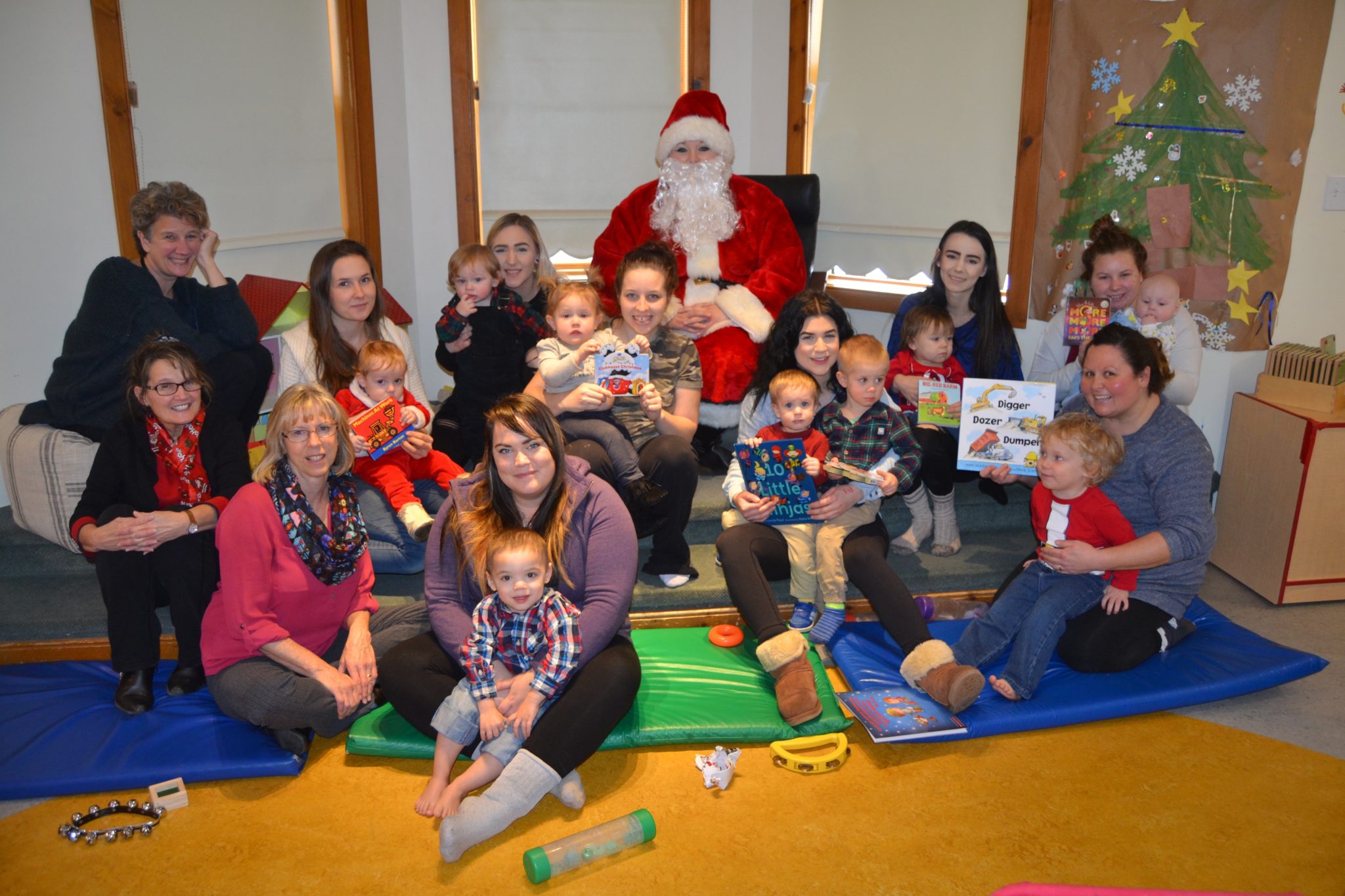 <p>SPECIAL DELIVERY- Santa Claus stopped by the Babies and Beyond group on Tuesday at the Hub Childcare Centre and delivered books supplied by County Kids Read to little learners and their moms. (Jason Parks/Gazette Staff)</p>
