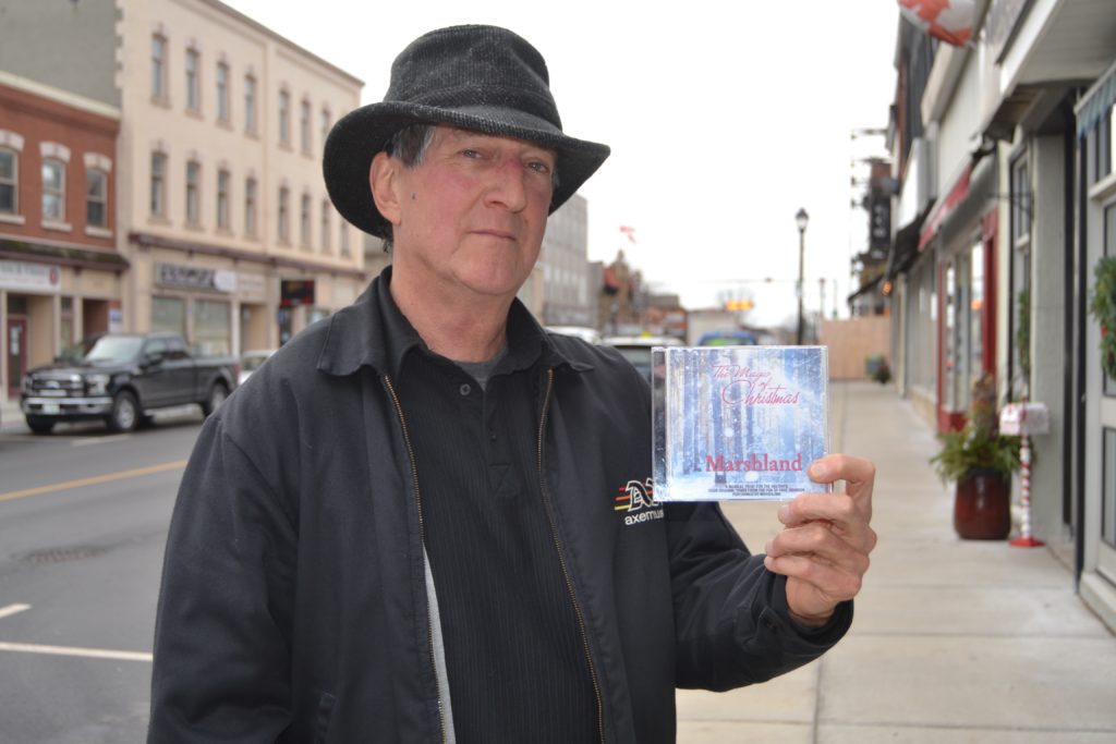 <p>Paul Johnson showcases Marshland’s 2016-released Christmas CD. Marshland will be leading Fiddle and Frostbite again this year. (Jason Parks/Gazette file photo)</p>
