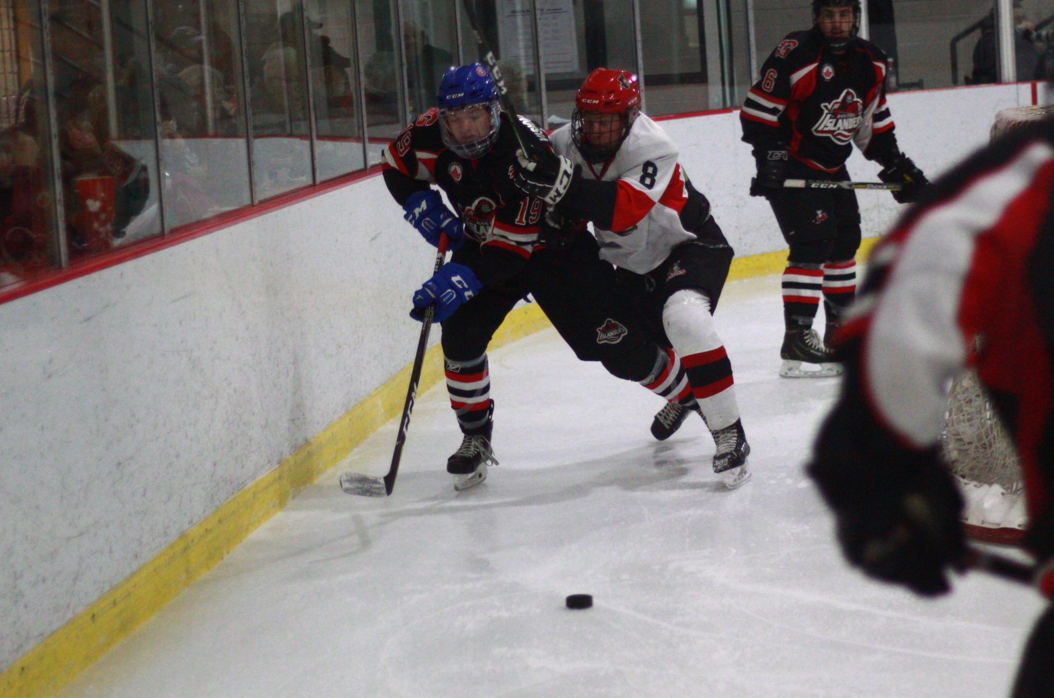 <p>Gananoque&#8217;s Jacob Ovens and Picton&#8217;s Noah Brant race for a loose puck during a Nov. 23 contest. (Chad Ibbotson/Gazette staff)</p>

