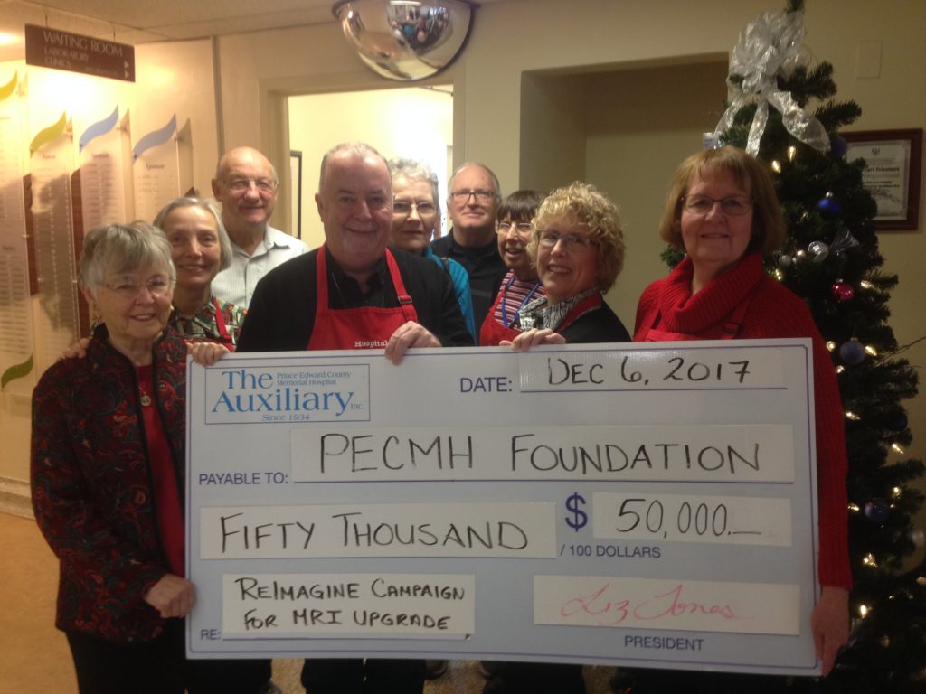 <p>JUST RE-IMAGINE-  The Prince Edward County Memorial Hospital Auxiliary contributed $50,000 to the Re-Imagine Campaign for the replacement of the MRI machine at Belleville General Hosptial. The funds for the $170,000 portion to be collected from Prince Edward County is being gathered by the Prince Edward County Memorial Hospital Foundation. Pictured from left at back: Art Hewer, vice president of the Auxiliary, Pam Strachan, Jack Starkey and Ann White.  From left at front: Fran Donaldson, vice chair of the PECMHF, Eugenia Venchiarutti, Andre Gratton, Cathy Starkey and Pat Evans, president of the Auxiliary.</p>
