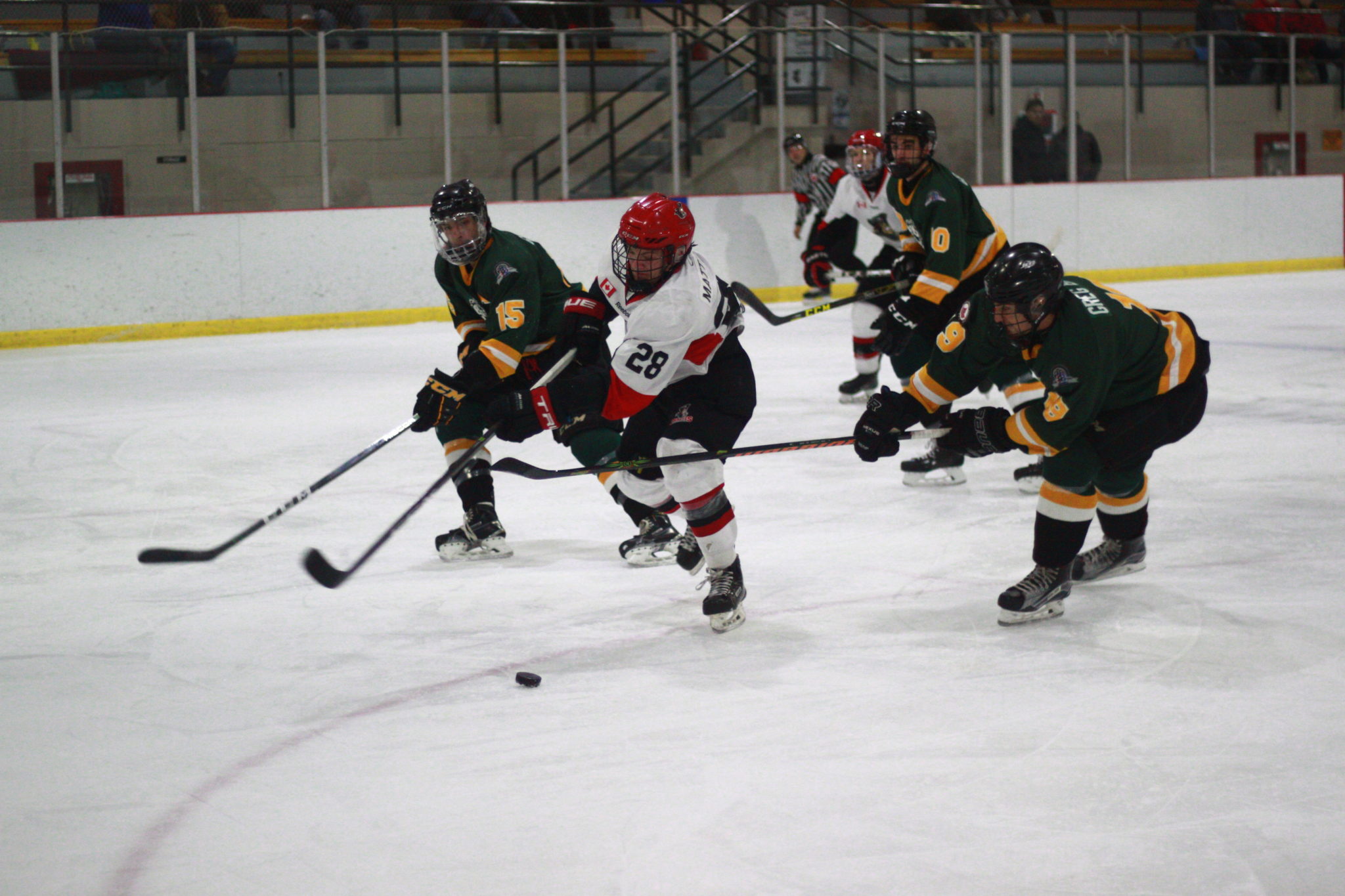 <p>Picton Pirates forward Bailey Matthews fends off Wyatt Crampton and Cody Smith of the Amherstview Jets on his way to the net. Matthews picked up a pair of assists in the game. (Chad Ibbotson/Gazette staff)</p>
