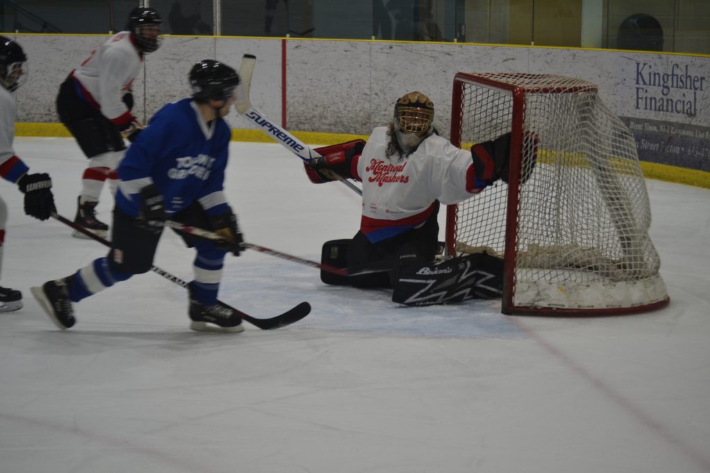 <p>A BISCUIT IN A BASKET- Toronto Grinders forward Etienne Lemieux of DrakeOne Fifity sneaks a backhand shot past Montreal Mashers goaltender and Drake Commissary chef Joel Dolman during the Second annual Drake Cup hockey game in Wellington on Saturday. (Jason Parks/Gazette Staff)</p>

