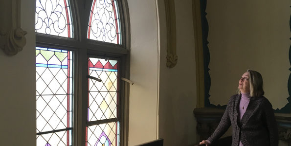 <p>Preserving panes -Picton United Church property and building committee chair Dianne Hadley studies one of the Victorian windows slated to be restored in the near future. (Adam Bramburger/Gazette staff)</p>
