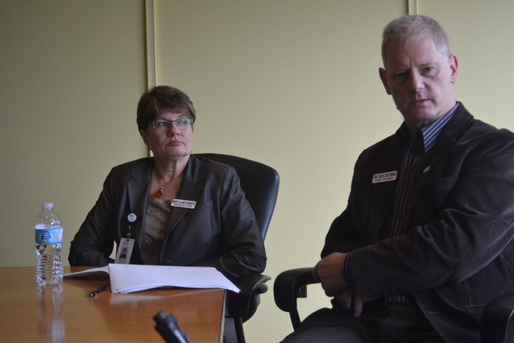 <p>NEW OPPORTUNITY- Qunite Health Care President and CEO Mary Clare Egberts listens as Chief of Staff Dr. Dick Zoutman speaks at a 2015 press conference. Zoutman has told QHC he is resigning his post in April to take a similar position in Scarborough, ON. (Jason Parks/Gazette Staff)</p>
