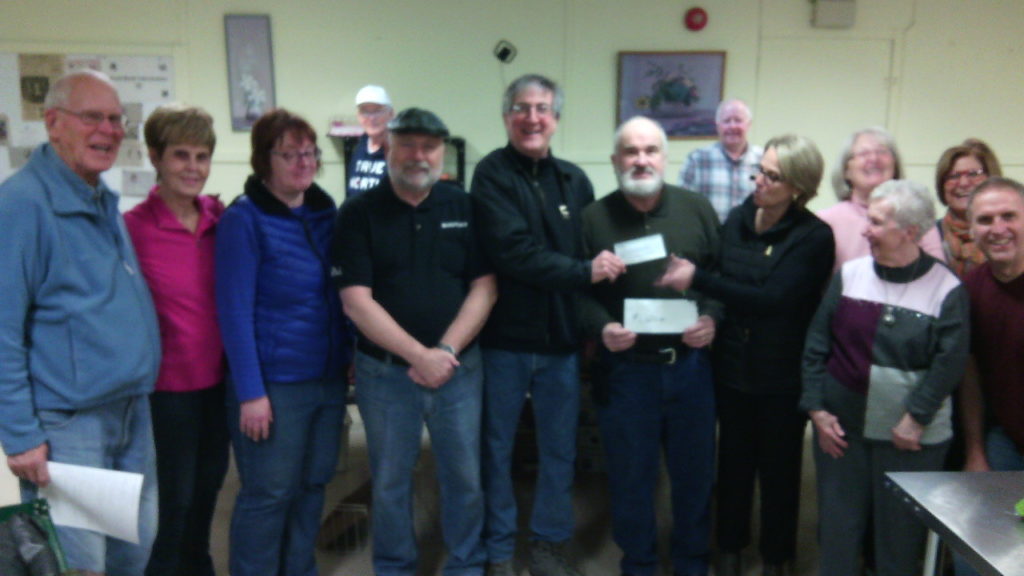 <p>Fiddle and Frostbite organizer Paul Johnson, centre, along with fellow musicians donated a cheque for $1,120 to the Picton United Church County Food Bank on Jan. 12. The donation represents 50 per cent of all proceeds from the Dec. 28 event. (Submitted photo)</p>
