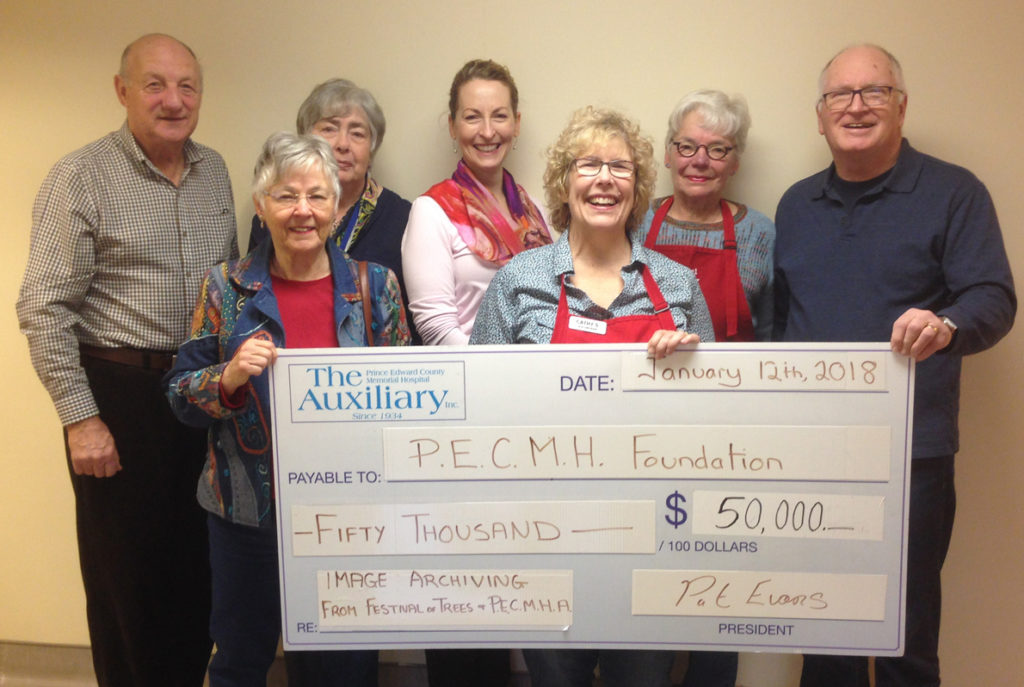 <p>On hand to present a $50,000 to the Prince Edward County Memorial Hospital Foundation were hospital auxiliary volunteers from left at back: auxiliary vice-president Art Hewer, foundation board member Sue Law, foundation executive director Penny Rolinski, Festival of Trees committee member Bev Thompson, and chair Jack Starkey and at front, from left, foundation vice-chair Fran Donaldson, and Festival of Trees committee member Cathy Starkey. (Briar Boyce/For The Gazette)</p>
