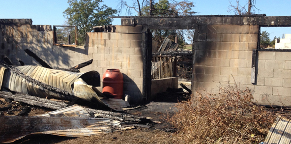 <p>Demolished – A burnt cinder block foundation is all that remained after a suspicious fire razed a barn on County Rd. 13 in October. The fire was one of several suspicious blazes with similar circumstances leading to an arson investigation. (Jason Parks/Staff)</p>

