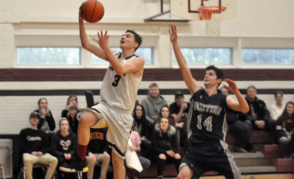 <p>Taking flight – PECI Senior Panther John McHugh concentrates on scoring a layup as Thomas A. Stewart’s Jake Hadzi defends. (Adam Bramburger/Gazette staff)</p>
