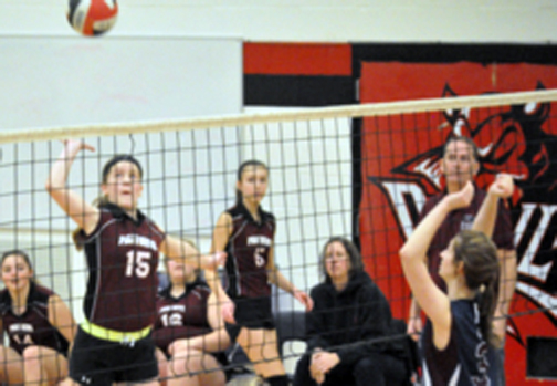 <p>Lined up -PECI Panthers hitter Trinity Roche prepares to smash a ball toward the St. Theresa Titans defence during the Bay of Quinte Conference bronze medal game Friday at Bayside. (Adam Bramburger/Gazette staff)</p>
