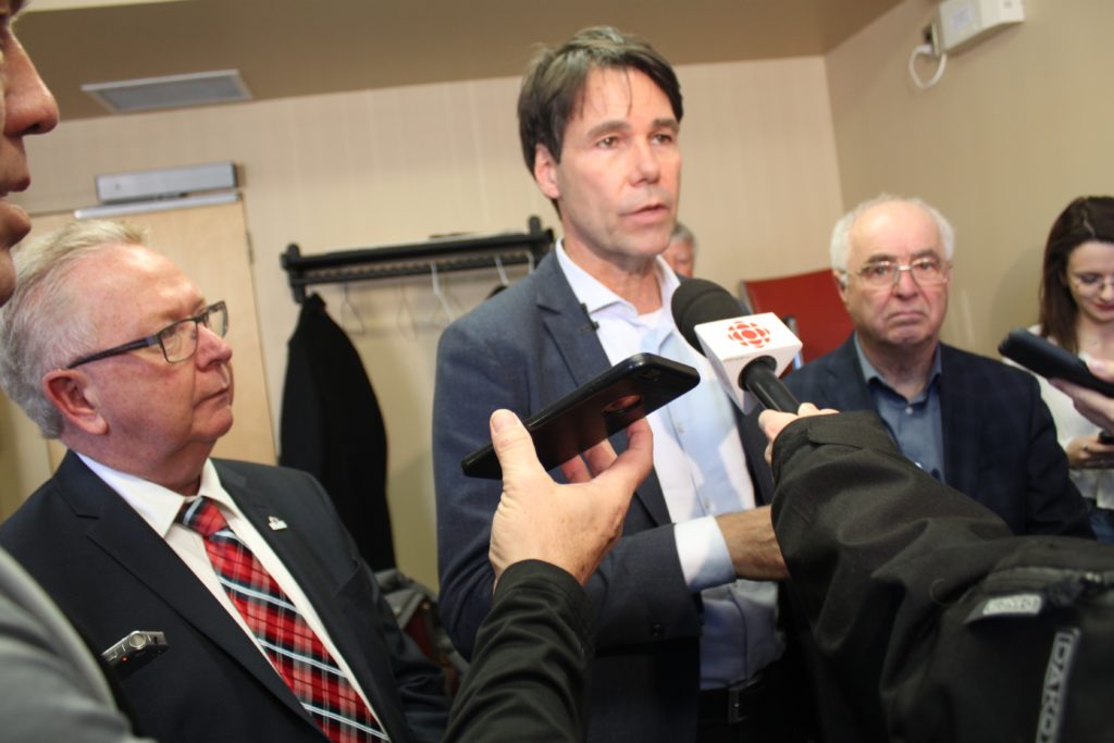 <p>A LONG TIME COMING- (Centre) Ontario’s Minister of Health and Longterm Care Dr. Eric Hoskins confirmed (left) Prince Edward County Mayor Robert Quaiff has been requesting an allotment of Long Term Care beds to replace those lost to the community when Picton Manor was forced to close by the Ministry in 2012. (Jason Parks/Gazette Staff)</p>
