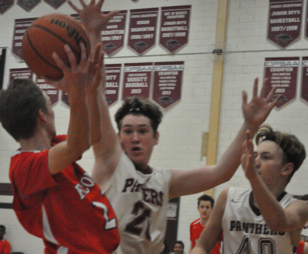 <p>No room – PECI Panthers Ryan Doolan, left, and Cole Lavender trap a St. Paul Falcon ball carrier along the sideline Friday. (Adam Bramburger/Gazette staff)</p>
