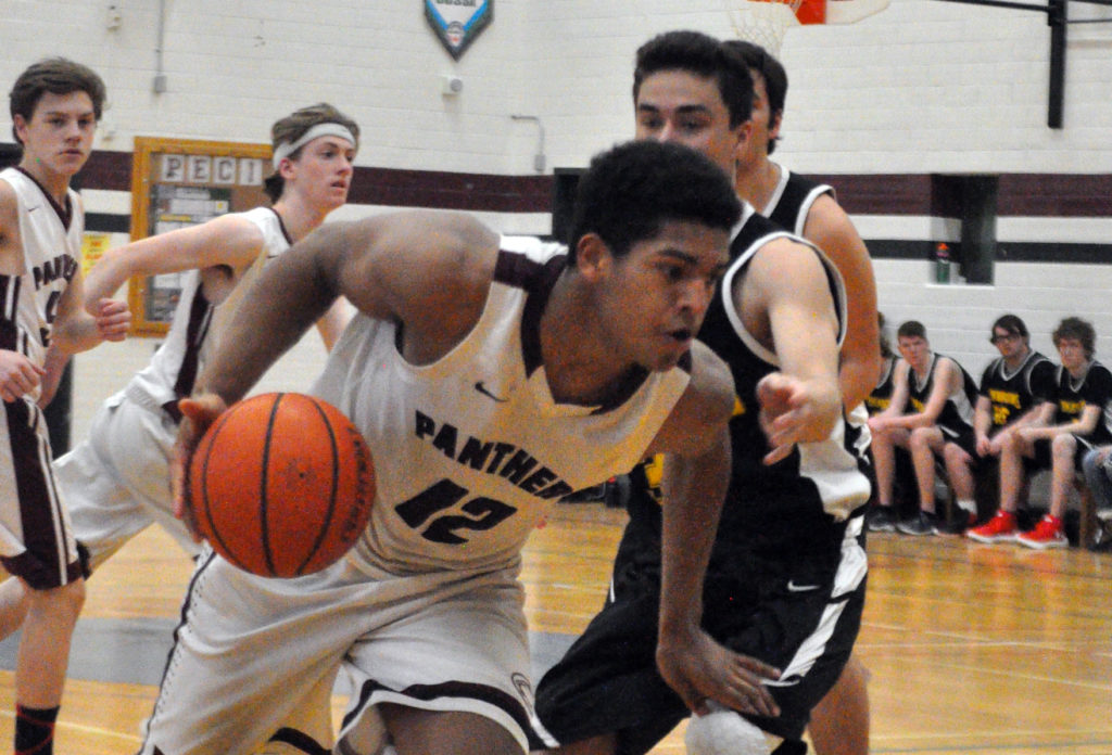 <p>Determined push – Alex Arsenault drops his shoulder and drives for the hoop during the PECI Senior Basketball Panthers’ 72-28 win over Centre Hastings Friday. (Adam Bramburger/Gazette staff)</p>
