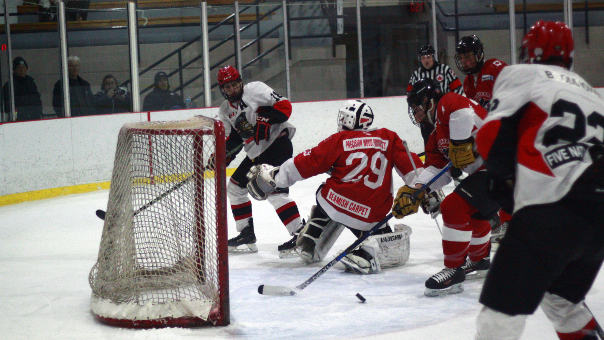 <p>Pirates forward Devin Morrison, left, looks on as a loose puck slides behind Campbellford goaltender Alex Ward. (Chad Ibbotson/Gazette staff)</p>
