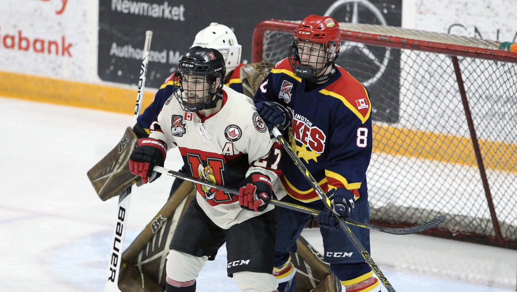 <p>IN A GOOD PLACE-Newmarket Hurricane Ryan Hunt and  Wellington Duke Geoff Lawson battle for positioning in front of the Dukes net. Wellington won Game 3 of the 2018 OJHL Northeast Conference Semi-Finals 2-1 at Essroc Arena Tuesday.<br />
(Photo by Tim Bates / OJHL Images)</p>
