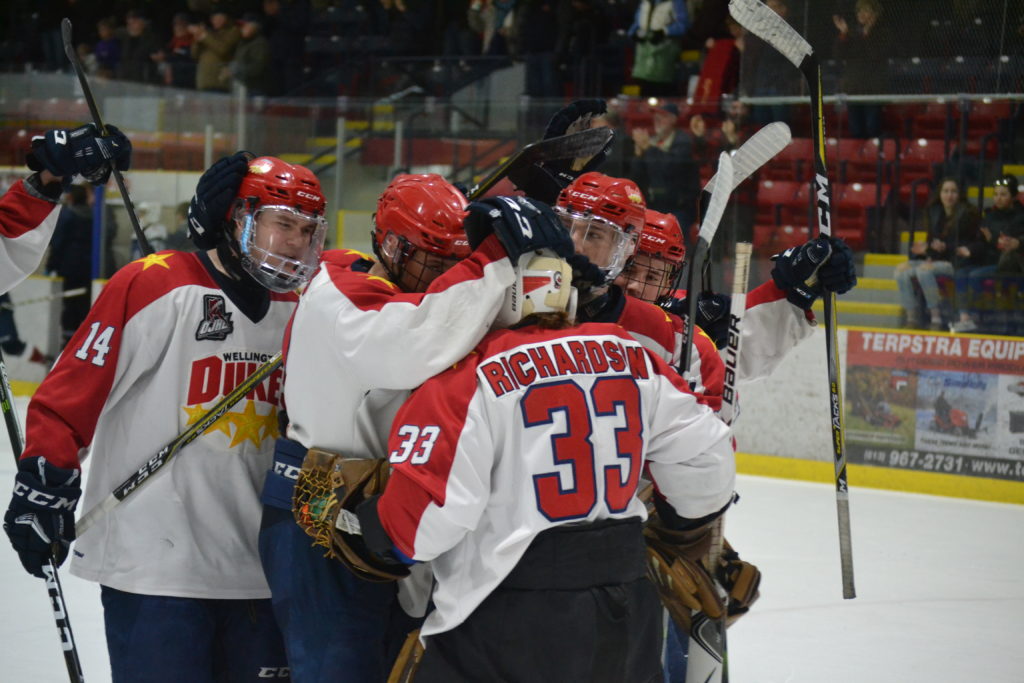 <p>THE MARCH MOVES ON- Wellington Dukes players mob goaltender Tyler Richardson after he made 16 saves and picked up his first win of the post season Tuesday night. Wellington punched their ticket to the second round of the 2018 Buckland Cup playoffs with a 6-2 win over Pickering. (Jason Parks/Gazette Staff)</p>
