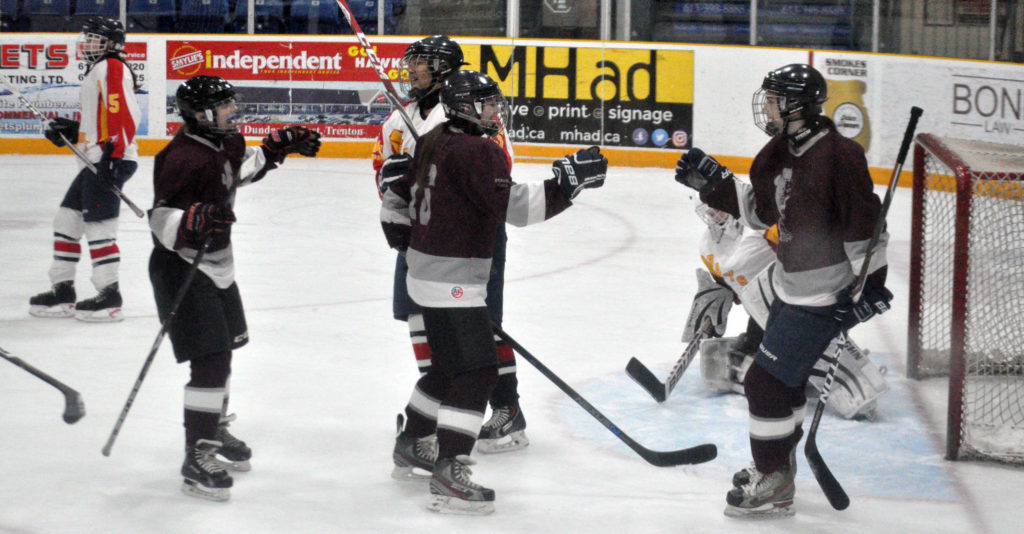 <p>Tally one – PECI Panthers, from left, Sydney Davies, Kendra Marion, and Brooke Jackson celebrate Marion’s second of two goals in a 4-3 loss in the Bay of Quinte Conference bronze medal game in Trenton Thursday. (Adam Bramburger/Gazette staff)</p>
