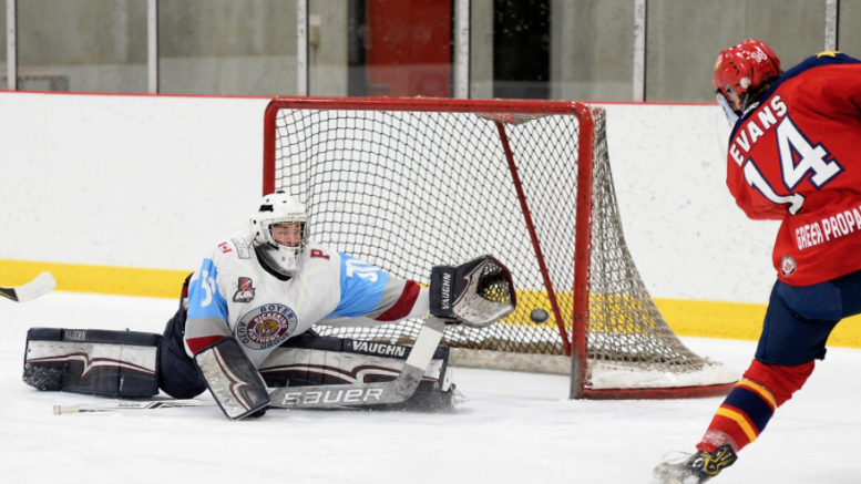 <p>GETTING IN FRONT- Wellington Duke Ben Evans puts a puck past Pickering Panther Ethan Langevin in the first period of Game Two at the Pickering Recreation Complex Sunday night. (Shawn Muir/OJHL Images)</p>
