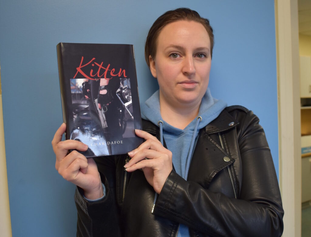 <p>KITTEN HAS CLAWS- Prince Edward County Author Char Dafoe and her debut novel Kitten. (Jason Parks/Gazette Staff)</p>
