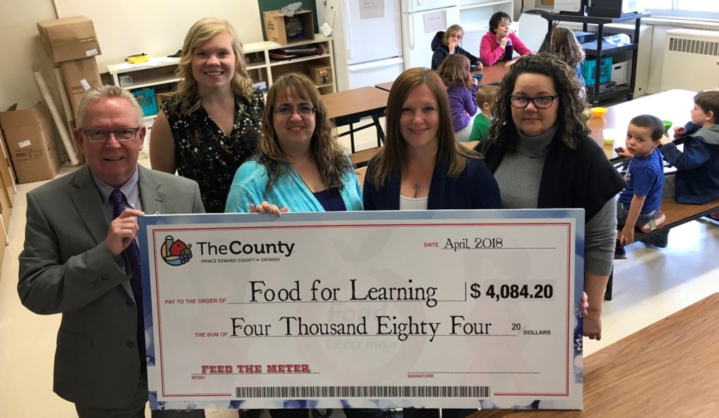 <p>Mayor Robert Quaiff presents the County’s Feed the Meter cheque for $4,084.20 to Vicky Struthers, Food for Learning Community Development Co-ordinator, Kellie Brace, Student Nutrition Program Coordinator, Kim Myderwyk, Principal at Queen Elizabeth School, and Terri Martin, a volunteer at Queen Elizabeth School. (Submitted photo)</p>
