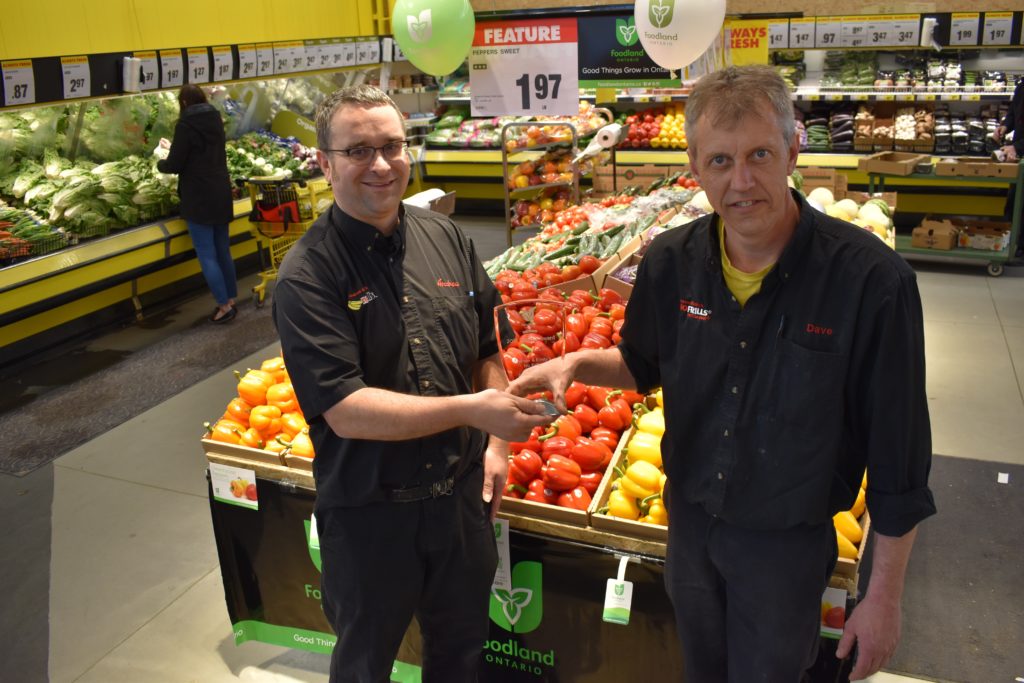 <p>PROVINCIAL AWARD WINNERS- Picton No Frill’s store owner Andrew Januszkiewicz and Produce Manager Dave Wright show off the 2018 Foodland Ontario Platinum Retailers award. The store was recognized for the promotion of local and Ontario-grown produce. (Jason Parks/Gazette Staff)</p>
