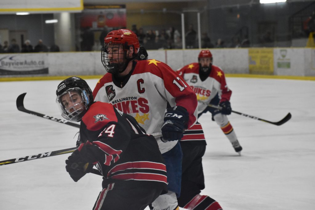 <p>MOST VALUBLE PLAYER- Wellington Dukes captain Colin Doyle keeps Georgetown Raiders forward Josh Nixon in check during the second period of Game 6 of the 2018 Buckland Cup finals Sunday evening. Doyle was awarded the Brent Ladds trophy as 2018 Playoff MVP. (Jason Parks/Gazette Staff)</p>
