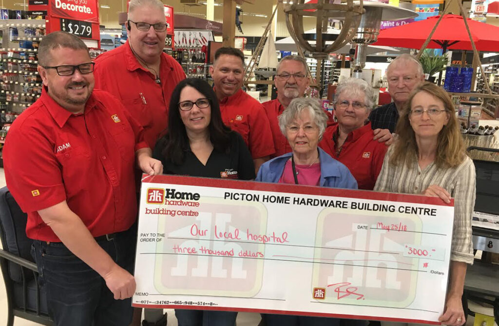 <p>Home helps hospital – At front, Picton Home Hardware’s Adam and Chrissy Busscher (at left) and electronics recycling co-ordinator Linda Ryan (right) present a $3,000 cheque to Prince Edward County Memorial Hospital Foundation vice president Fran Donaldson as Home Hardware associates (back row, from left) Darren Haennel, Paul Courtney, Robert Matthews, Monica Baldwin and foundation past-president Leo Finnegan look on. (Adam Bramburger/Gazette staff)</p>
