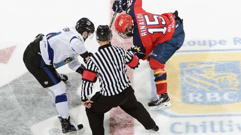 <p>Wellington’s Andrew Rinaldi faces off against Wenatchee Wild centre Jasper Weatherby Thursday. (Matthew Murnaghan/Hockey Canada Images)</p>
